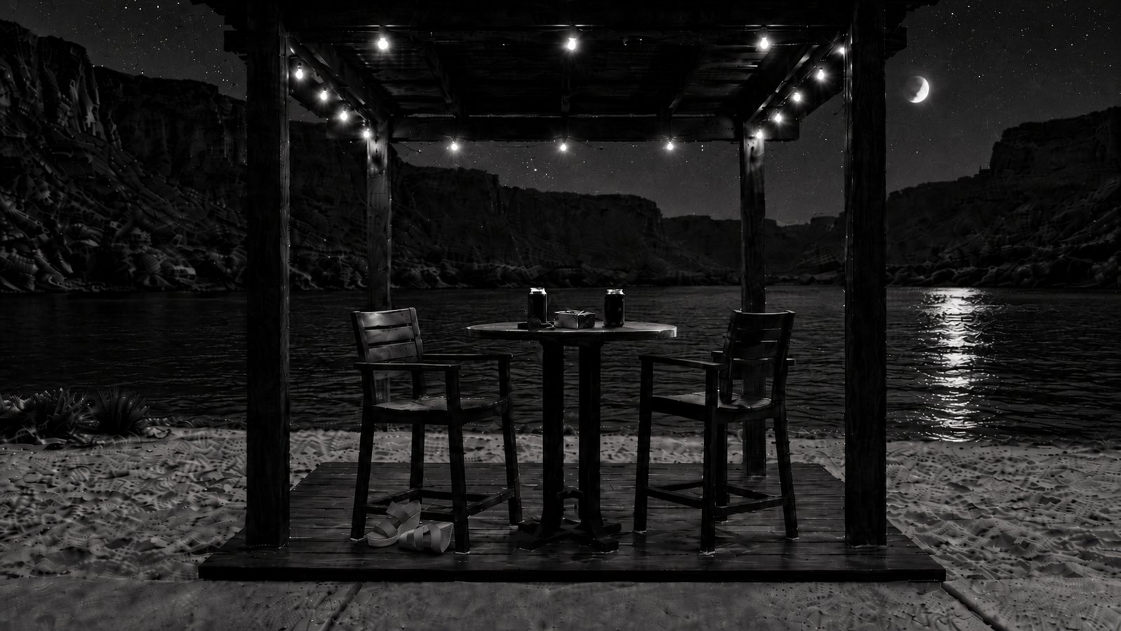 His cabana at night: a bar table and two chairs under string lights, the river and canyon behind